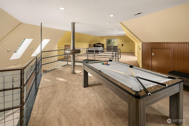 rec room with lofted ceiling, pool table, and light colored carpet