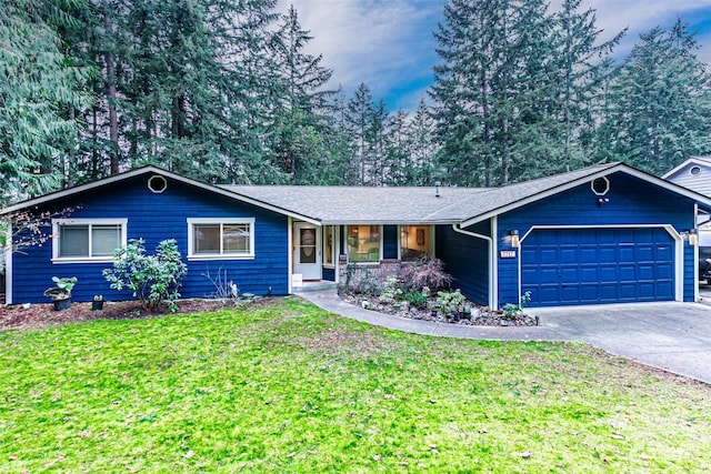 single story home with a garage and a front lawn