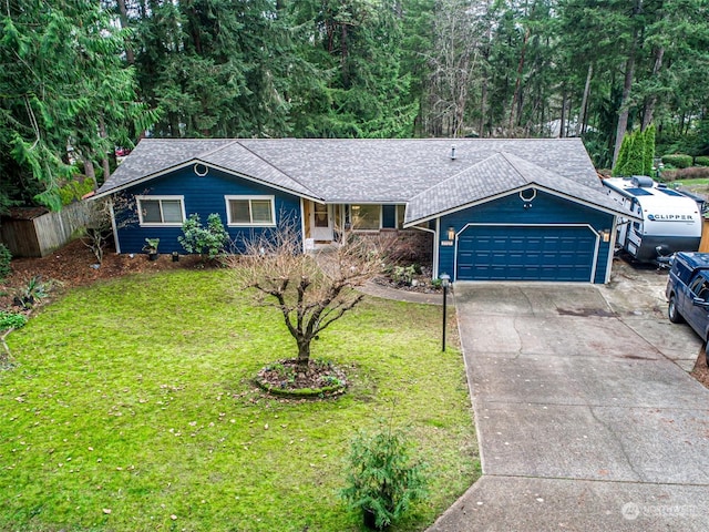 ranch-style home featuring a front lawn and a garage