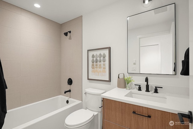 full bathroom with vanity, toilet, and tiled shower / bath combo