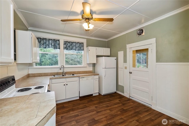 kitchen featuring visible vents, ornamental molding, white cabinets, a sink, and white appliances