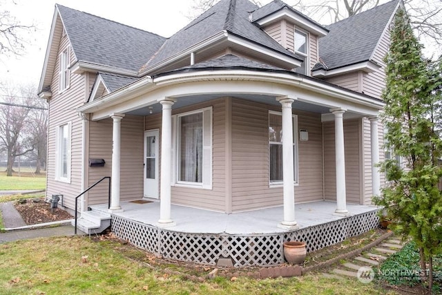 view of side of home with a porch