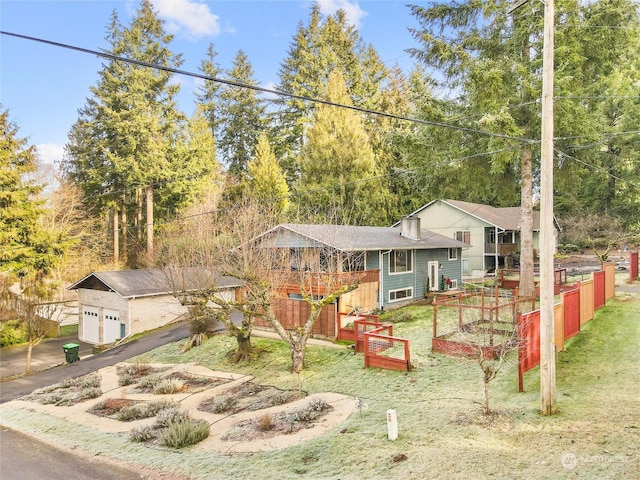 view of front of property with a garage and a front yard