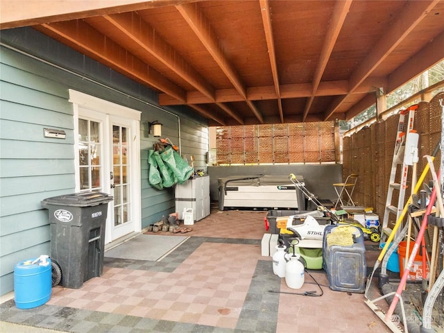 view of patio / terrace featuring a jacuzzi and french doors