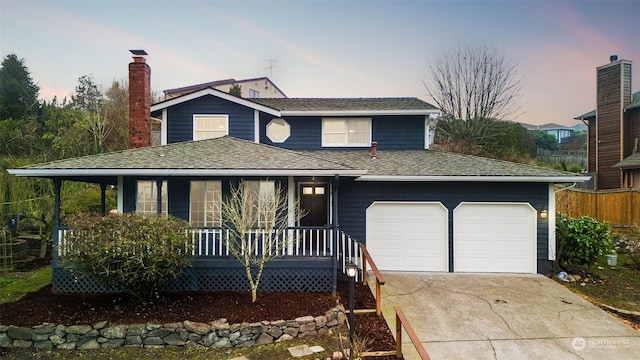 view of front of house with a porch and a garage