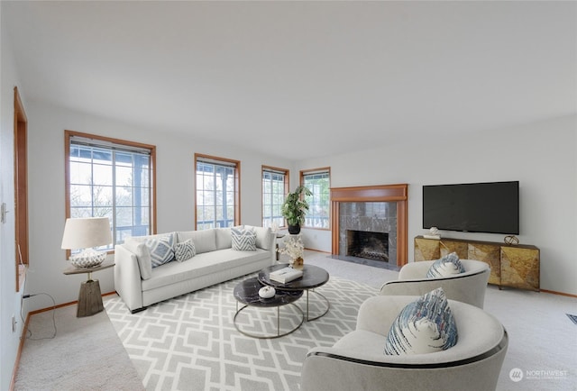 living room featuring a premium fireplace and light carpet