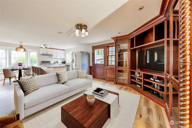 living room with light hardwood / wood-style flooring