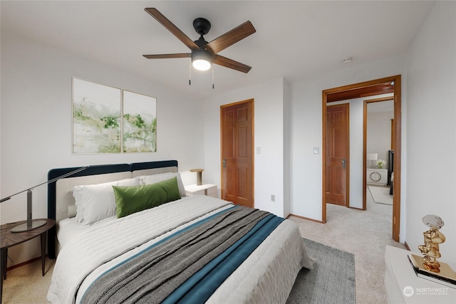 carpeted bedroom with ceiling fan