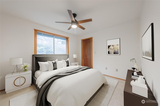 bedroom featuring ceiling fan and light colored carpet