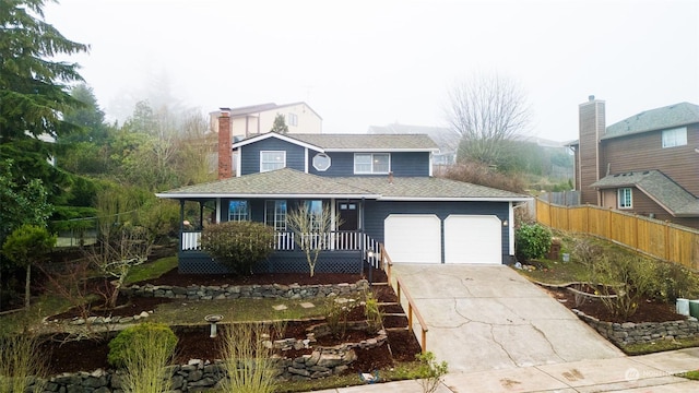 view of front of house with covered porch and a garage