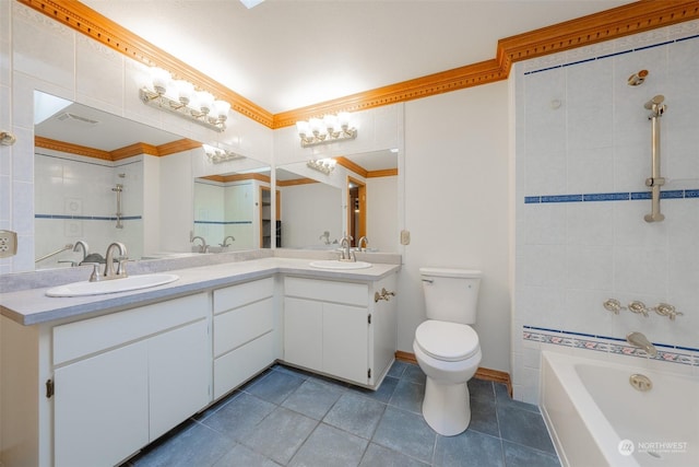 bathroom featuring toilet, vanity, ornamental molding, and a bathtub