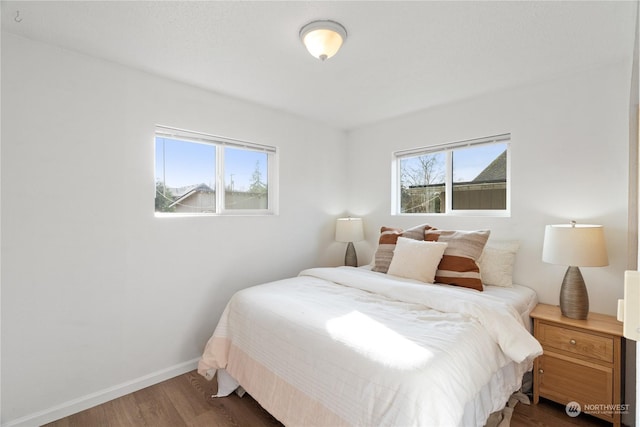 bedroom featuring dark wood-type flooring