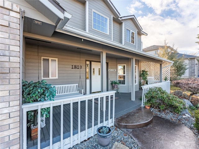 property entrance with a porch