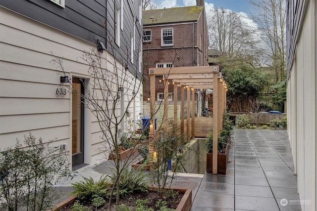 exterior space with a pergola and a patio