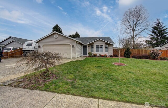 single story home featuring driveway, a garage, fence, and a front lawn