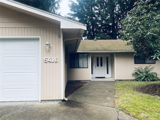 view of exterior entry featuring a garage