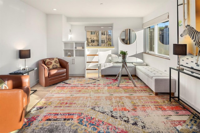 living area with light hardwood / wood-style flooring