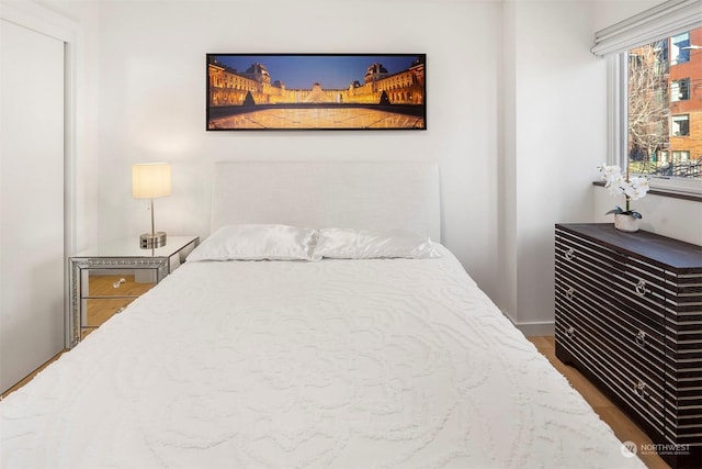 bedroom featuring dark hardwood / wood-style flooring