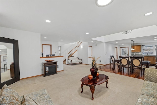 carpeted living room featuring sink