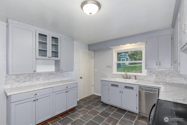 kitchen featuring dishwasher, backsplash, electric range oven, and sink