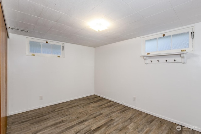 basement with dark wood-type flooring