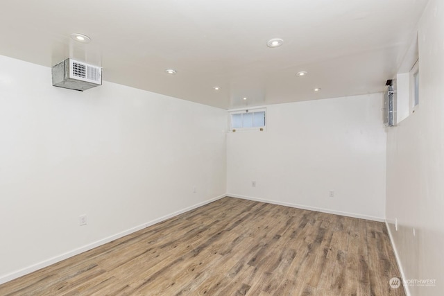 spare room featuring wood-type flooring