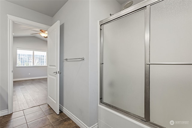 bathroom with ceiling fan, bath / shower combo with glass door, tile patterned floors, and lofted ceiling