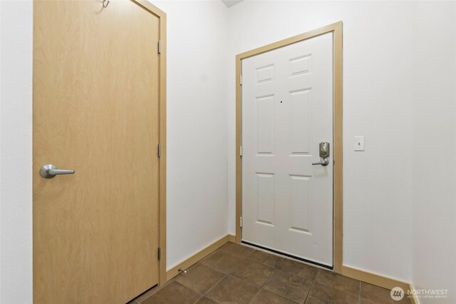 foyer entrance with baseboards