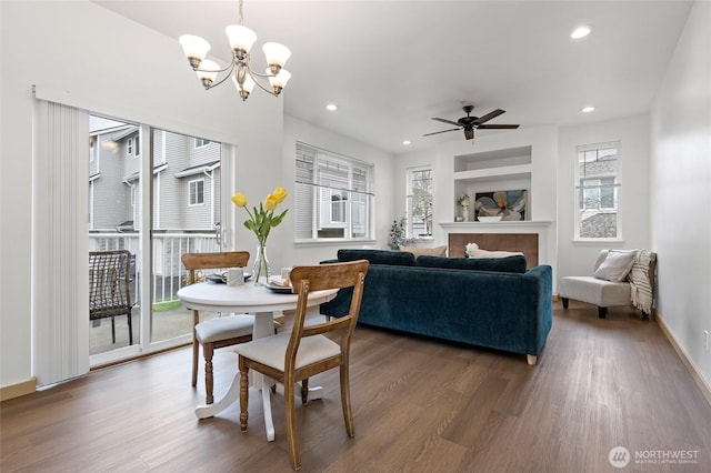 dining room featuring plenty of natural light, recessed lighting, and wood finished floors