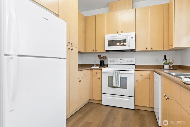 kitchen with white appliances, light wood-style flooring, and light brown cabinetry