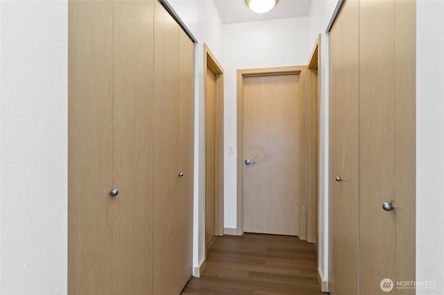 corridor featuring wood finished floors