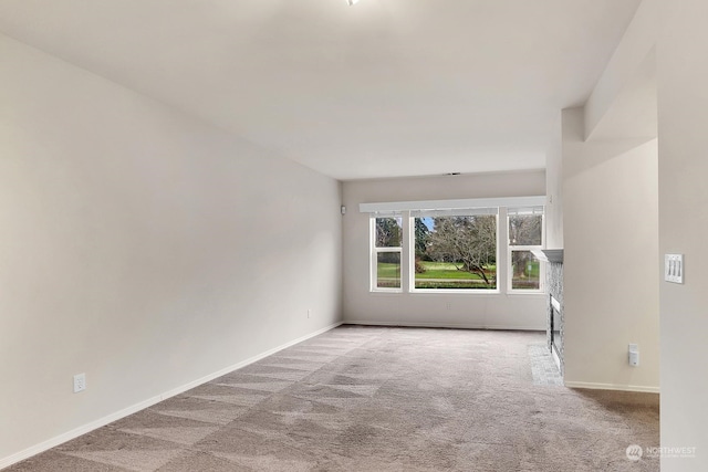 empty room with light colored carpet