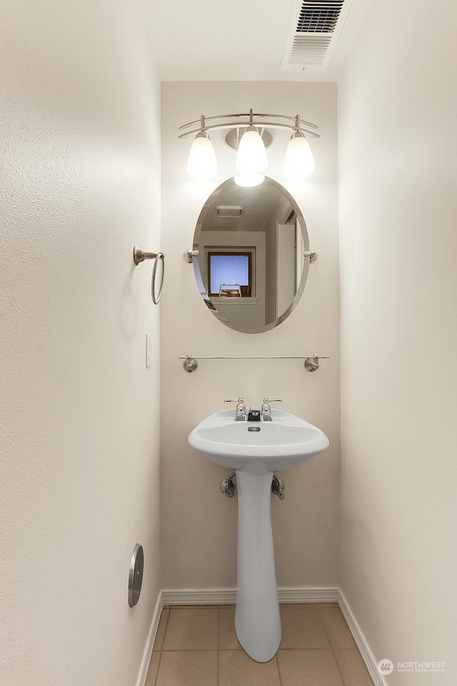 bathroom with sink and tile patterned floors