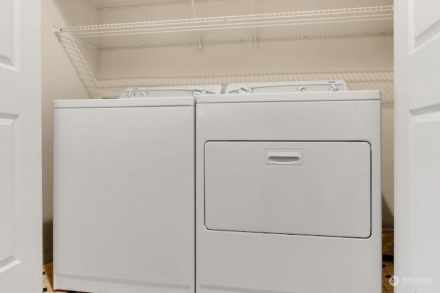 laundry area with washing machine and clothes dryer