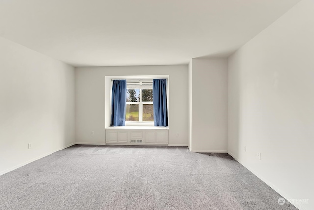 empty room with light colored carpet