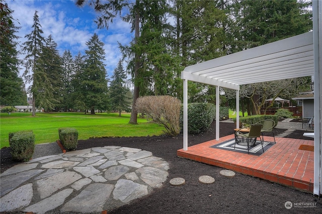 view of patio / terrace with a fire pit and a pergola