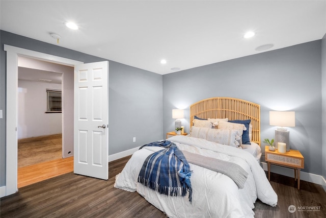 bedroom with dark wood-type flooring