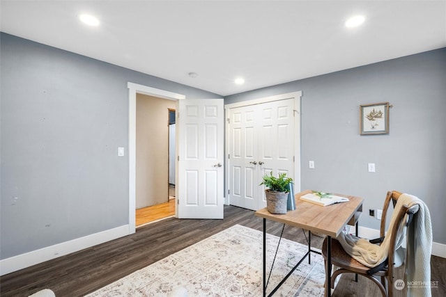 office space with dark wood-type flooring