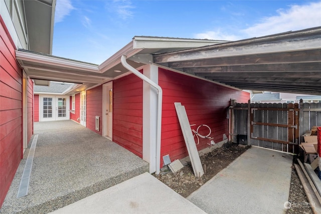 view of side of property featuring a carport