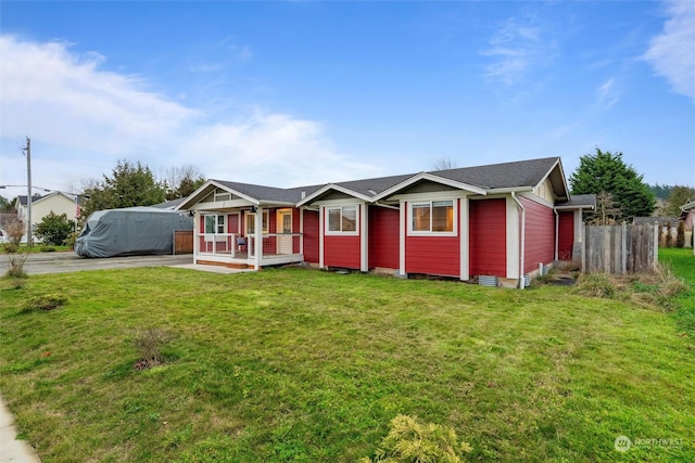 ranch-style home with a front lawn