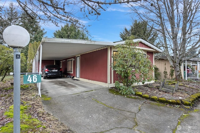 exterior space featuring a carport