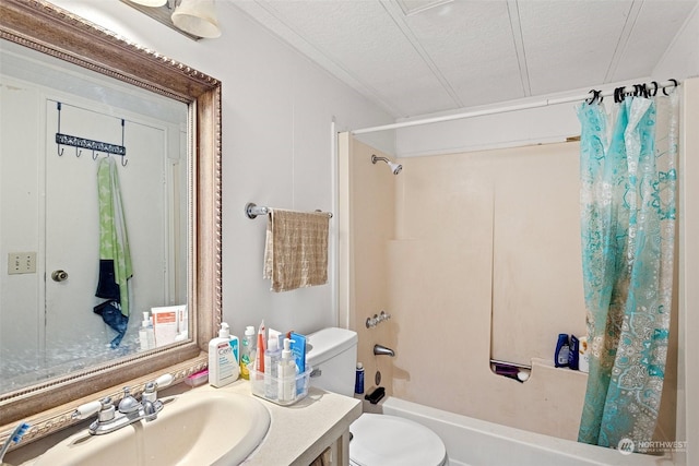 full bathroom with toilet, vanity, a textured ceiling, and shower / bath combo with shower curtain