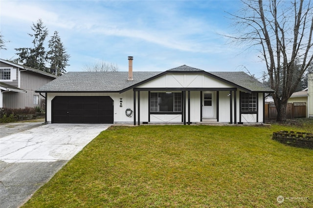 view of front facade with a front lawn and a garage