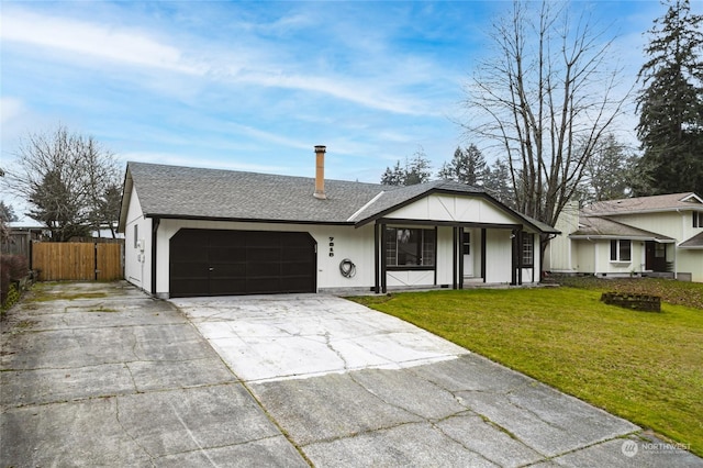 single story home featuring a front yard and a garage