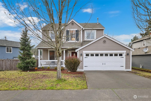 view of property featuring a porch, a garage, and a front yard