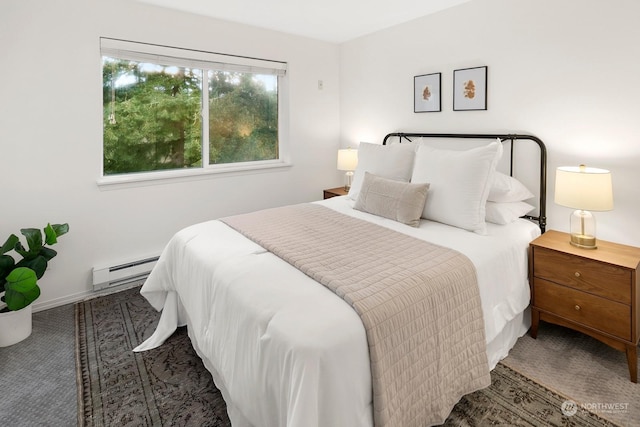 carpeted bedroom featuring baseboard heating