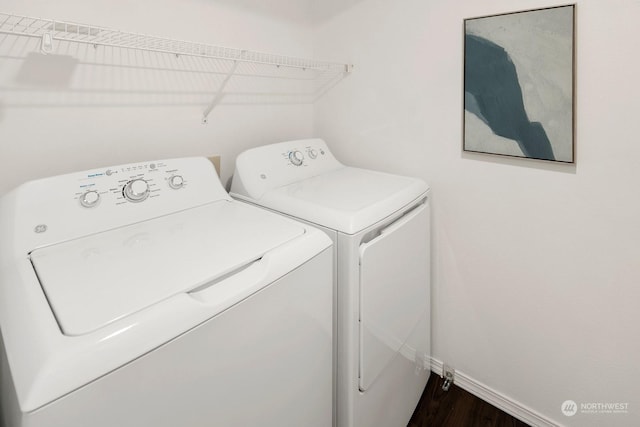 washroom featuring dark hardwood / wood-style flooring and independent washer and dryer