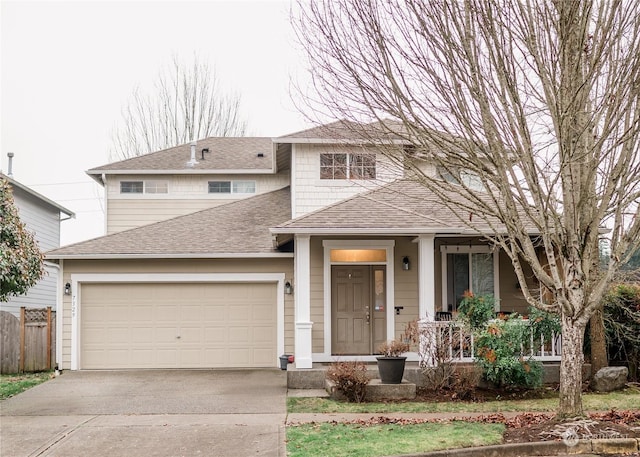 view of front of home featuring covered porch and a garage