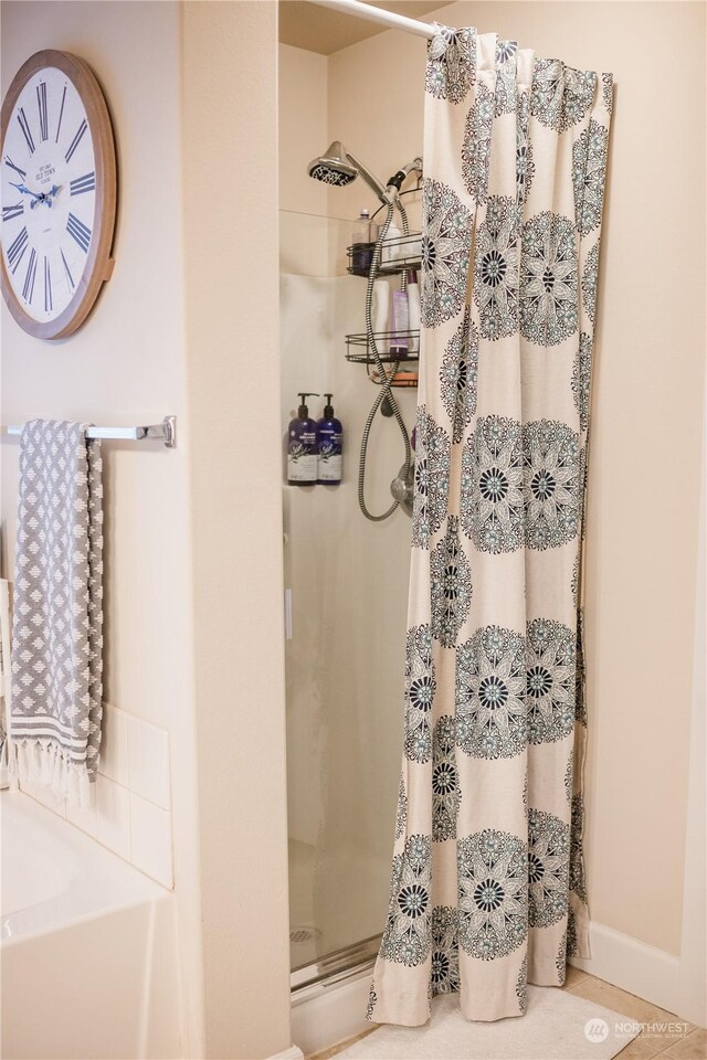 bathroom featuring a shower with curtain