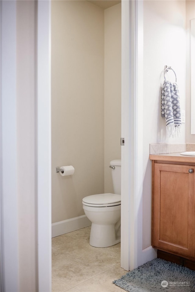 bathroom with toilet and vanity